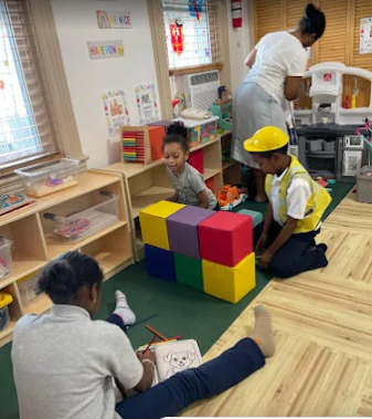 Children playing with soft building blocks in the Happy Little Hearts playroom